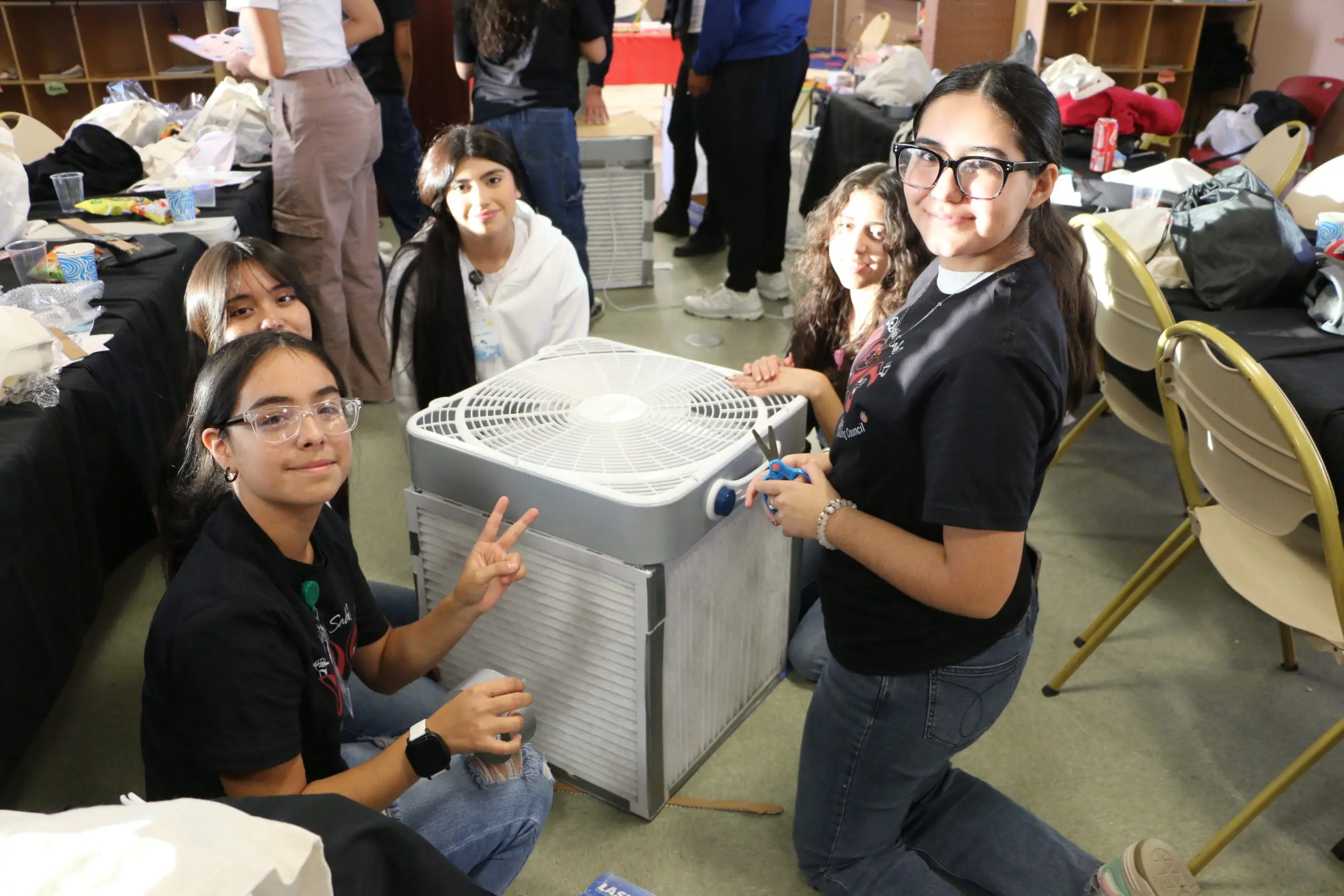 YO-C members build a air filtration device from regular household supplies.