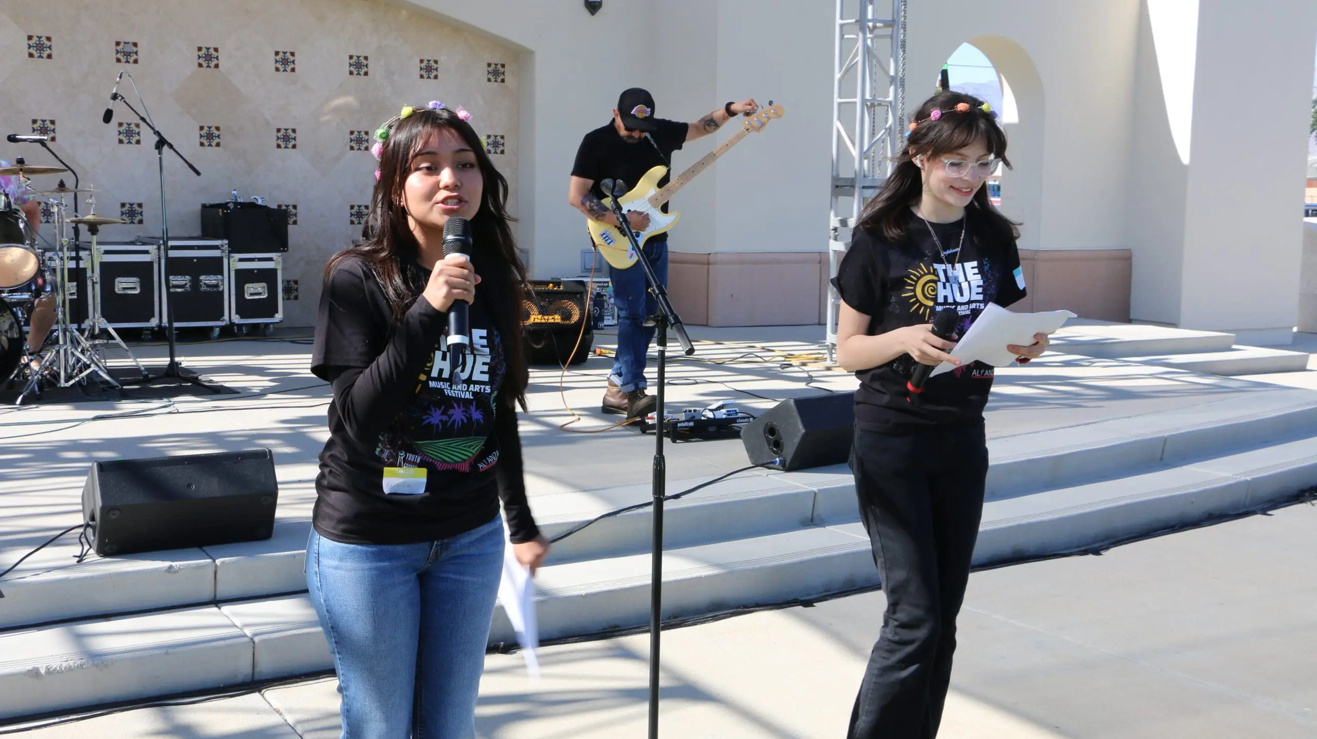 Youth practice their public speaking skills at The Hue Music & Arts Festival.